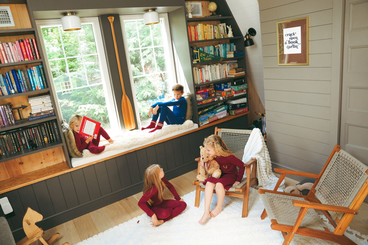 children relaxing at home in matching jack and Becky pajamas 