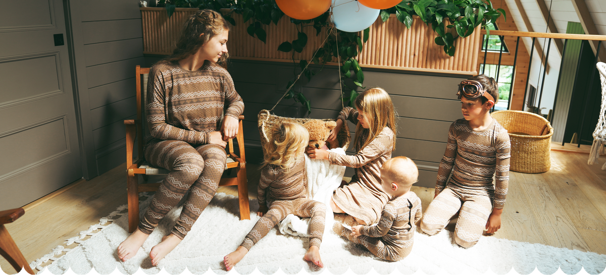 A family wearing matching pajamas before bedtime